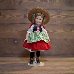 Vintage Danberry Mint Shirley Temple Heidi Doll on stand.